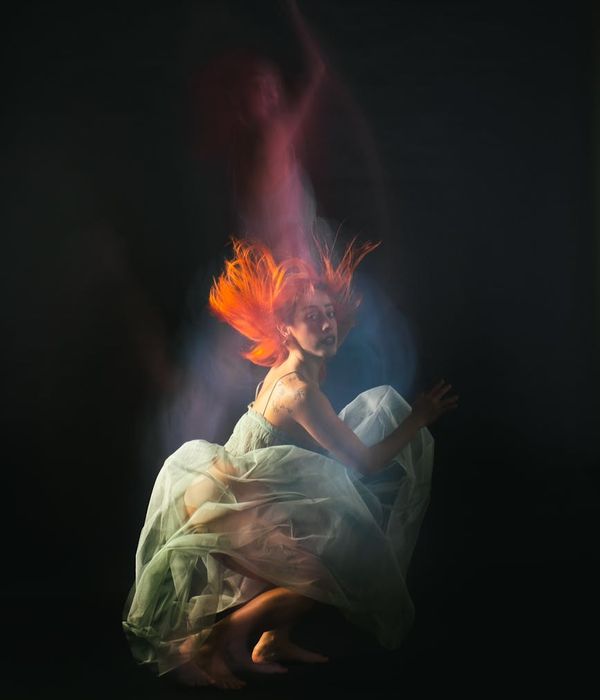 Woman performing a fluid cardio movement in a calm environment.